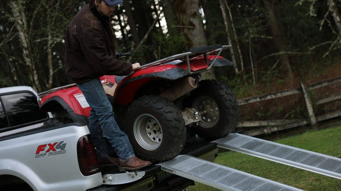 Loading a vehicle on a ramp.
