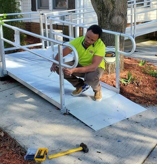 Worker putting a ramp together.